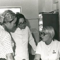 Nancy Anderson, shore secretary, with counterpart and patient